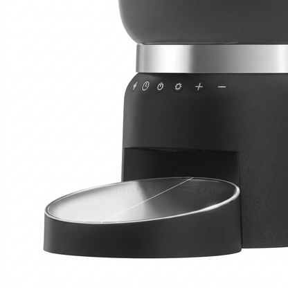 Tail-wagged smart pet feeder with digital controls and remote access for automatic, programmable pet meal feeding.
