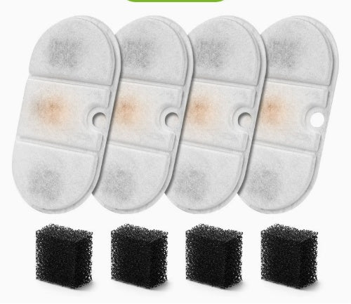 Four reusable filter pads with visible staining and four black sponge blocks shown below on a plain white background.